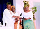 Miscellaneous Photos of 2010: Governor Godswill Akpabio displaying the Award for Infrastructural development of Akwa Ibom State and the Passage of the Child Rights Act, by Mboho Akwa Ibom/Northern Ireland